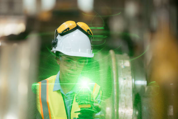 istock Railway technician in uniform and helmet inspect the train wheels 2111122677