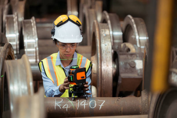 istock Railway technician in uniform and helmet inspect the train wheels 2111123709