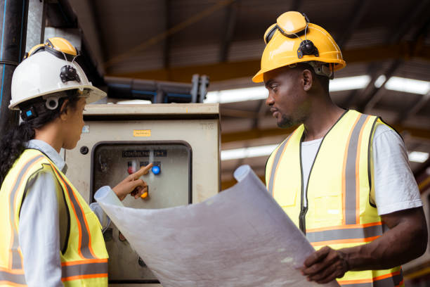 istock Railway technicians and engineers, Inspect the trains in train repair station before being used to drag train cars to receive or transport goods and people. 2111137540