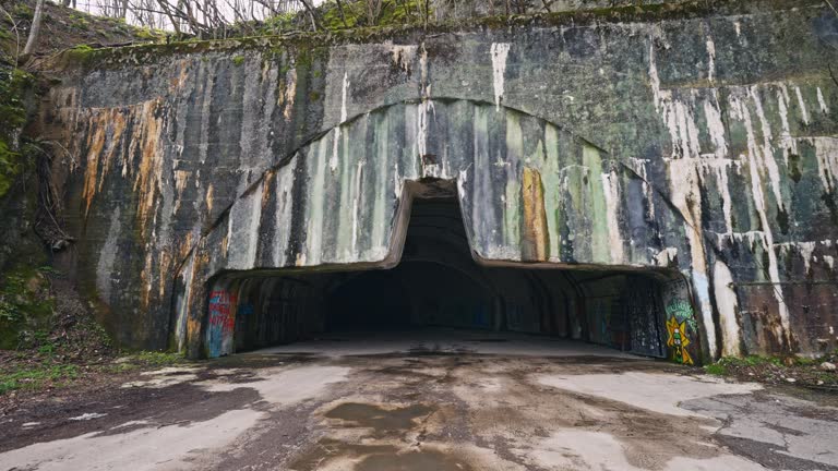 SLO MO POV Shot of Walking Towards Abandoned Underground Zeljava Air Base in Croatia