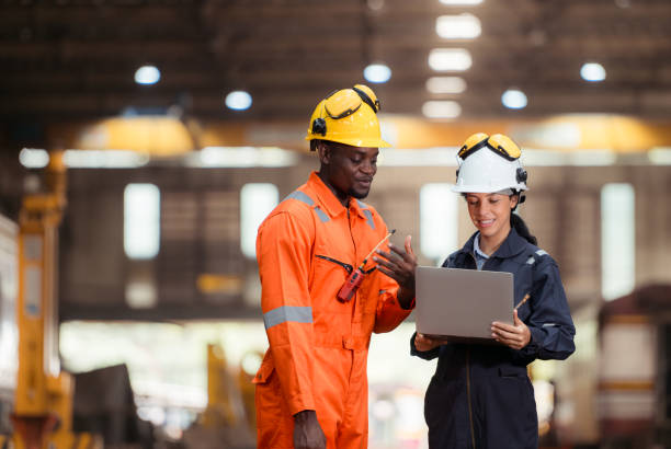 istock Railway technicians and engineers, Inspect the trains in train repair station before being used to drag train cars to receive or transport goods and people. 2111145734