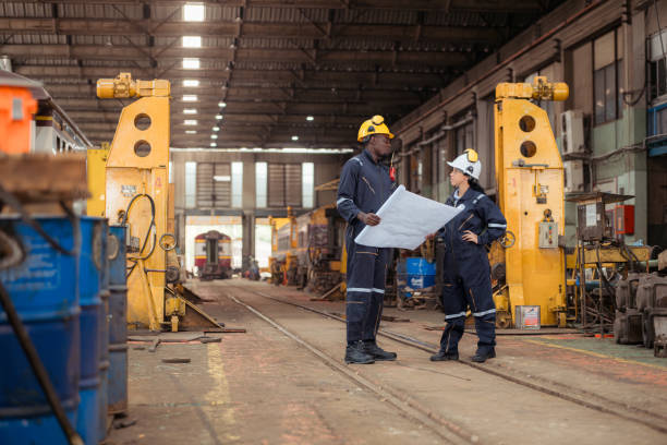 istock Railway technicians and engineers, Inspect the trains in train repair station before being used to drag train cars to receive or transport goods and people. 2111147806