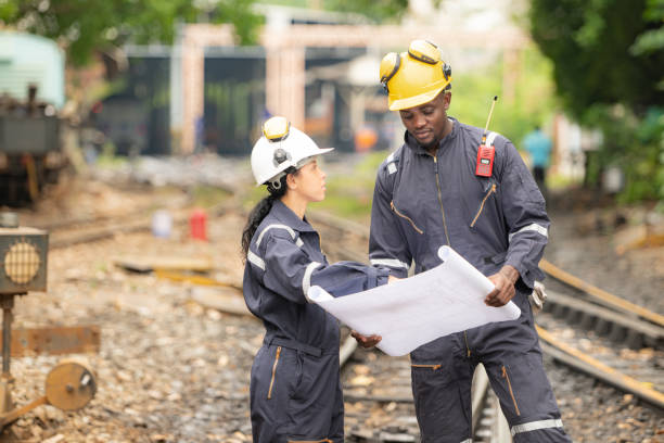 istock Railway technicians and engineers, Working on the train tracks at train station 2111148315