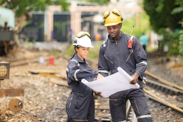 istock Railway technicians and engineers, Working on the train tracks at train station 2111148322