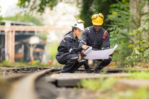 istock Railway technicians and engineers, Working on the train tracks at train station 2111148826