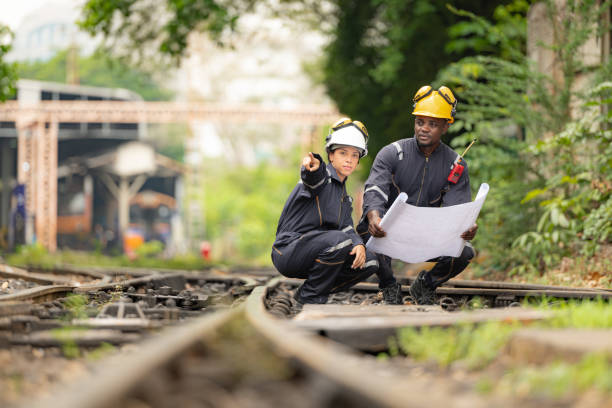 istock Railway technicians and engineers, Working on the train tracks at train station 2111148827