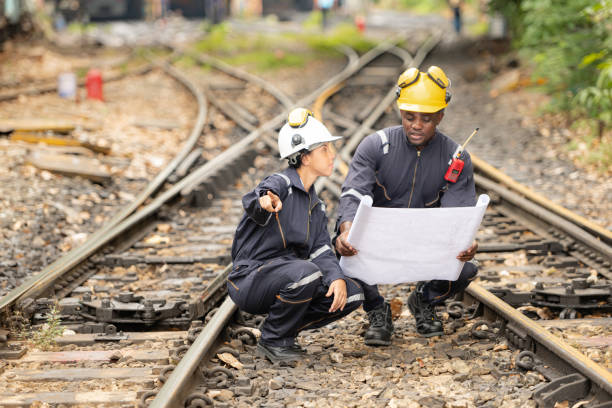istock Railway technicians and engineers, Working on the train tracks at train station 2111148829