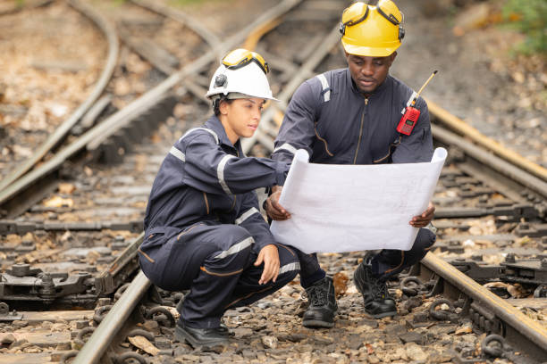 istock Railway technicians and engineers, Working on the train tracks at train station 2111148833