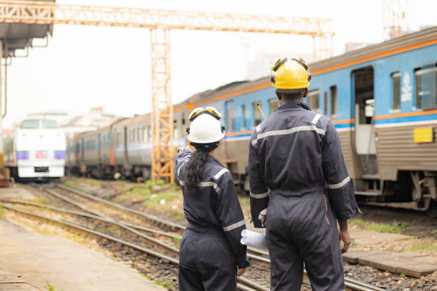 istock Railway technicians and engineers, Working on the train tracks at train station 2111149350