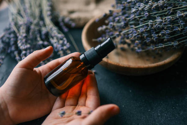 istock Natural cosmetic product with lavender in hands 2111199913