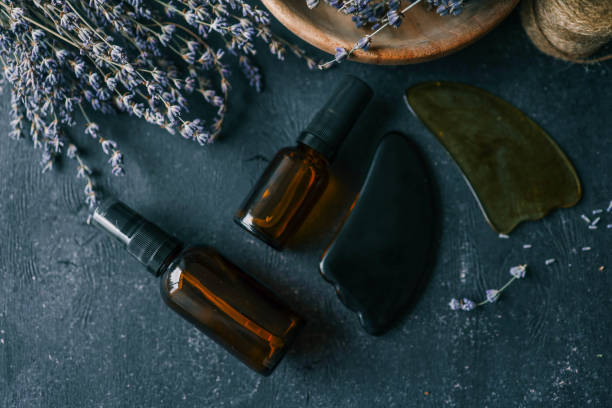 istock Natural cosmetic product with lavender and gua sha scrapers 2111199917
