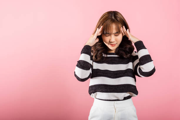 istock stress female person unhappy closed eyes problem she headache 2111200444