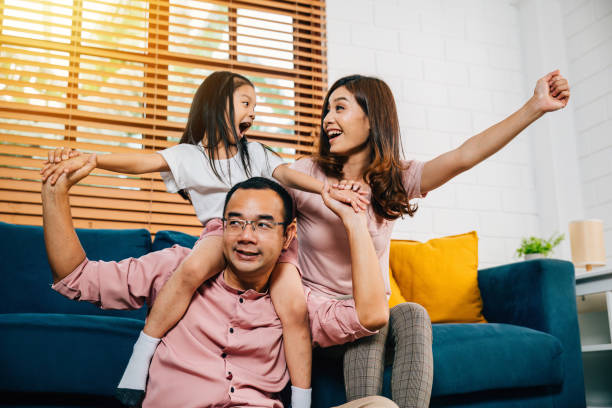 istock A joyful family in their comfortable modern house enjoys quality time on the sofa 2111219021
