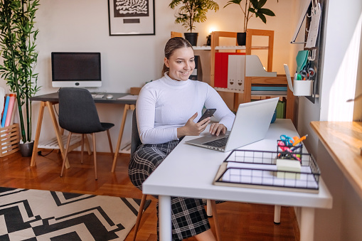 Beautiful woman enjoying while working from home