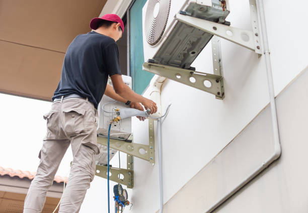istock Air Conditioning Repairman checking and fixing modern air conditioning system, Technician team checking leakage air conditioning system 2111254686