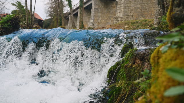 SLO MO Panning Shot of Beautiful Small Waterfall in Town, Croatia