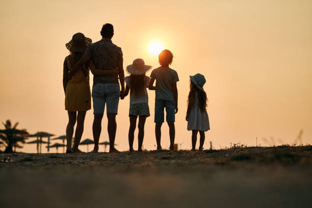 istock A family enjoying a tropical paradise beach during sunset 2111342828