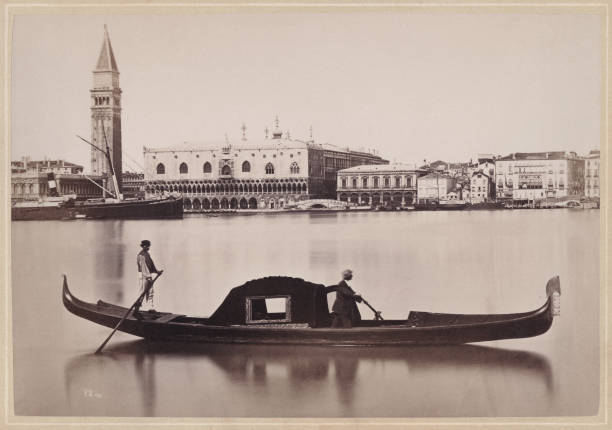 Historical view of Venice, Italy: Panorama of S. Giorgio and gondola. In the background Saint Mark's Bell Tower and Doge's Palace. Original photograph (scanned and slightly digitally restored) from the book 