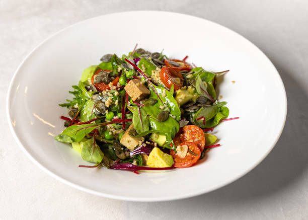 istock fresh salad, grilled vegetables in plate 2111348859
