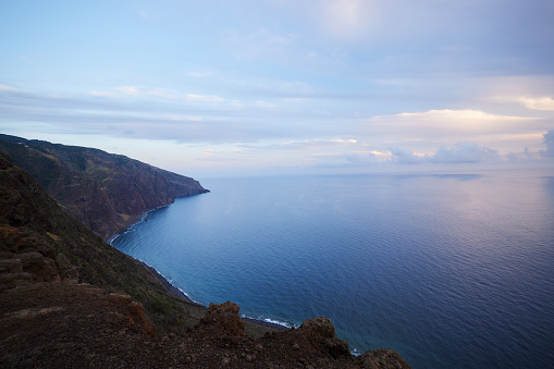 Background of view on the Atlantic ocean from a cliff at sunset.