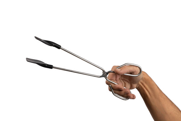 istock Male hand holding kitchen tong isolated white background 2111377701