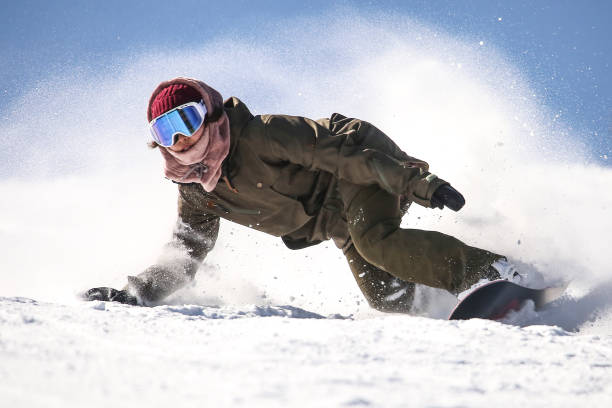 istock female snowboarder 2111410419