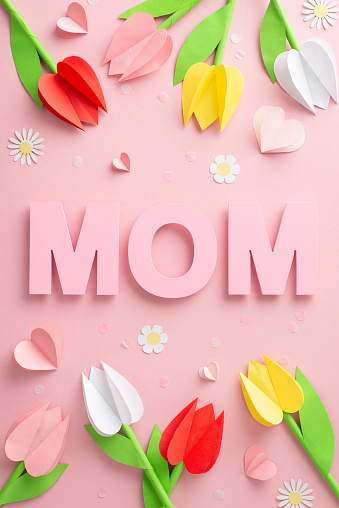Crafted celebration for Mother's Day, featuring vertical top view of paper tulips, 
