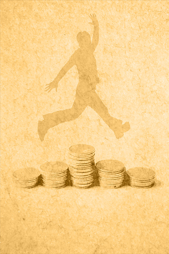 On young man jumping over Heaps of traced money or pile of old faded distressed golden colored currency coins arranged as set or stacks of abundant money over beige coloured vintage classic style cracked vertical vector background