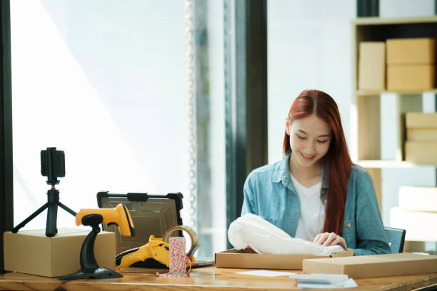 istock Small Business Owner Preparing Order for Shipment 2111449175