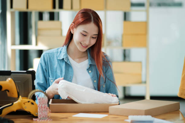 istock Small Business Owner Preparing Order for Shipment 2111449183
