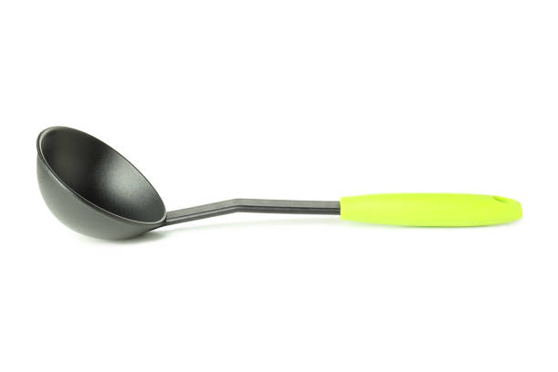 Metal kitchen ladle isolated on white background.