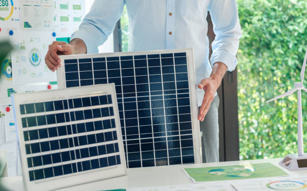 istock Diversity team presentation new design solar cell panel renewable energy innovation at office 2111459779
