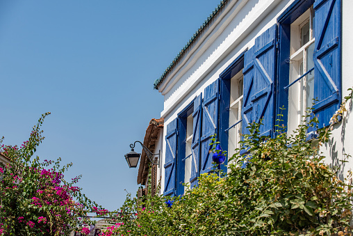 House with blue shutters in İzmir Sığacık