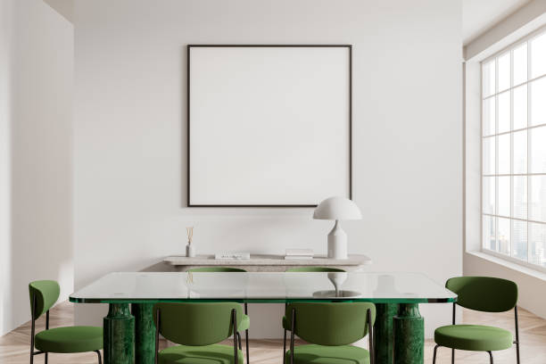 istock White dining room interior with green chairs and poster 2111504371