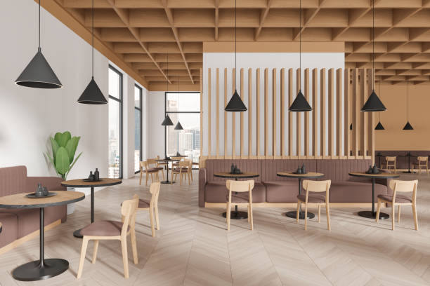istock Stylish cafe interior with chairs and tables in row, dining area and window 2111505396