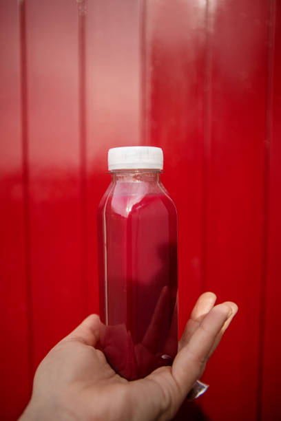 Red Beetroot, ginger and lemon smoothie on wooden Background. homemade detox drinks