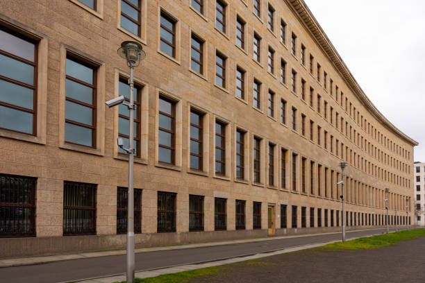 istock Along the facade of the building, a security camera hangs on every pole. 2111515837