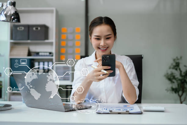 istock Elearning online working concept. Business woman working on laptop computer, searching and taking note on paper notebook with pen working in office. 2111517948