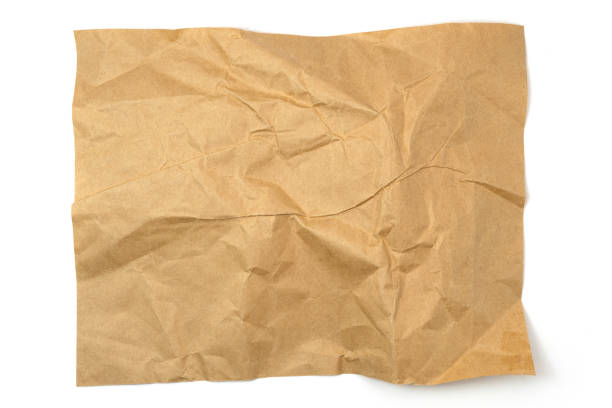 istock Brown crumpled paper isolated on white background 2111525025
