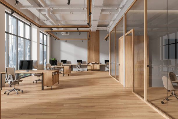 istock Gray and wooden open space office interior 2111526555