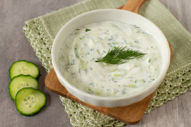 istock Tzatziki sauce in a white bowl. 2111528156