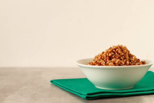 istock Boiled buckwheat in a plate 2111530777
