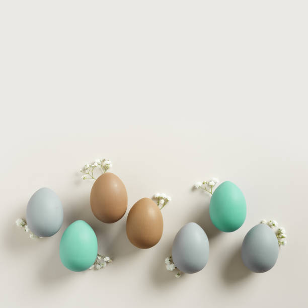 istock Pastel Easter Eggs as minimal pattern with white blooming Flowers on beige color, top view colorful chicken egg. Easter celebration concept. Festive food, still life holiday, aesthetic flat lay 2111537114