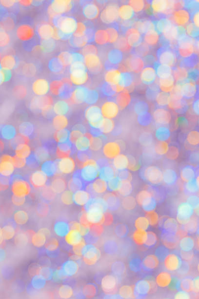 istock Defocused abstract bokeh background pastel colored, flare from lights, color gradient, blurred circle bokeh as holiday texture. Glittering aesthetic textured lighting pattern 2111557606