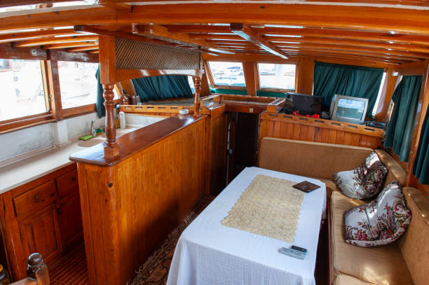 istock Wooden yacht kitchen and dining table 2111570562