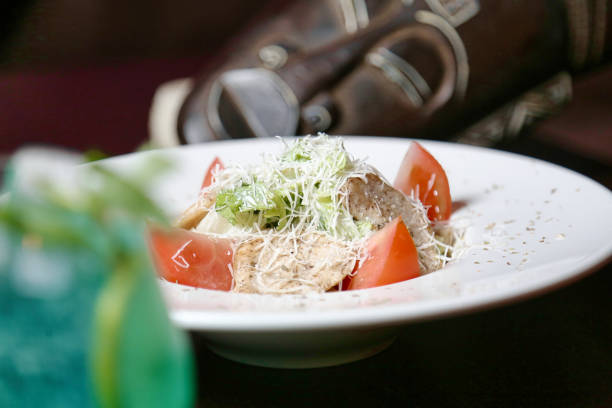 A close-up shot capturing the beautifully presented plate of food on a table.