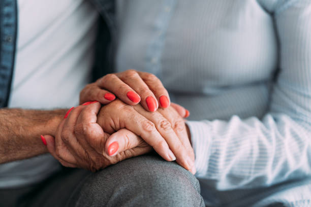 istock Senior couple holding hands. 2111579256