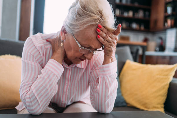 istock Senior woman suffering with a migraine. 2111579259