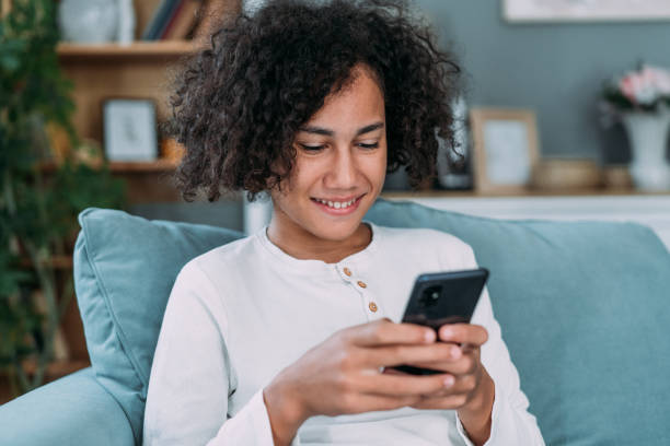 istock Teenager using smartphone at home. 2111583962