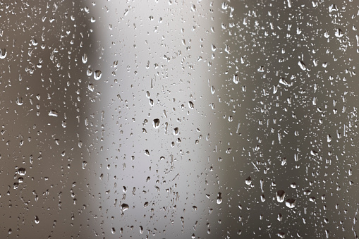 Rainy day on the outside.
Raindrops on window.